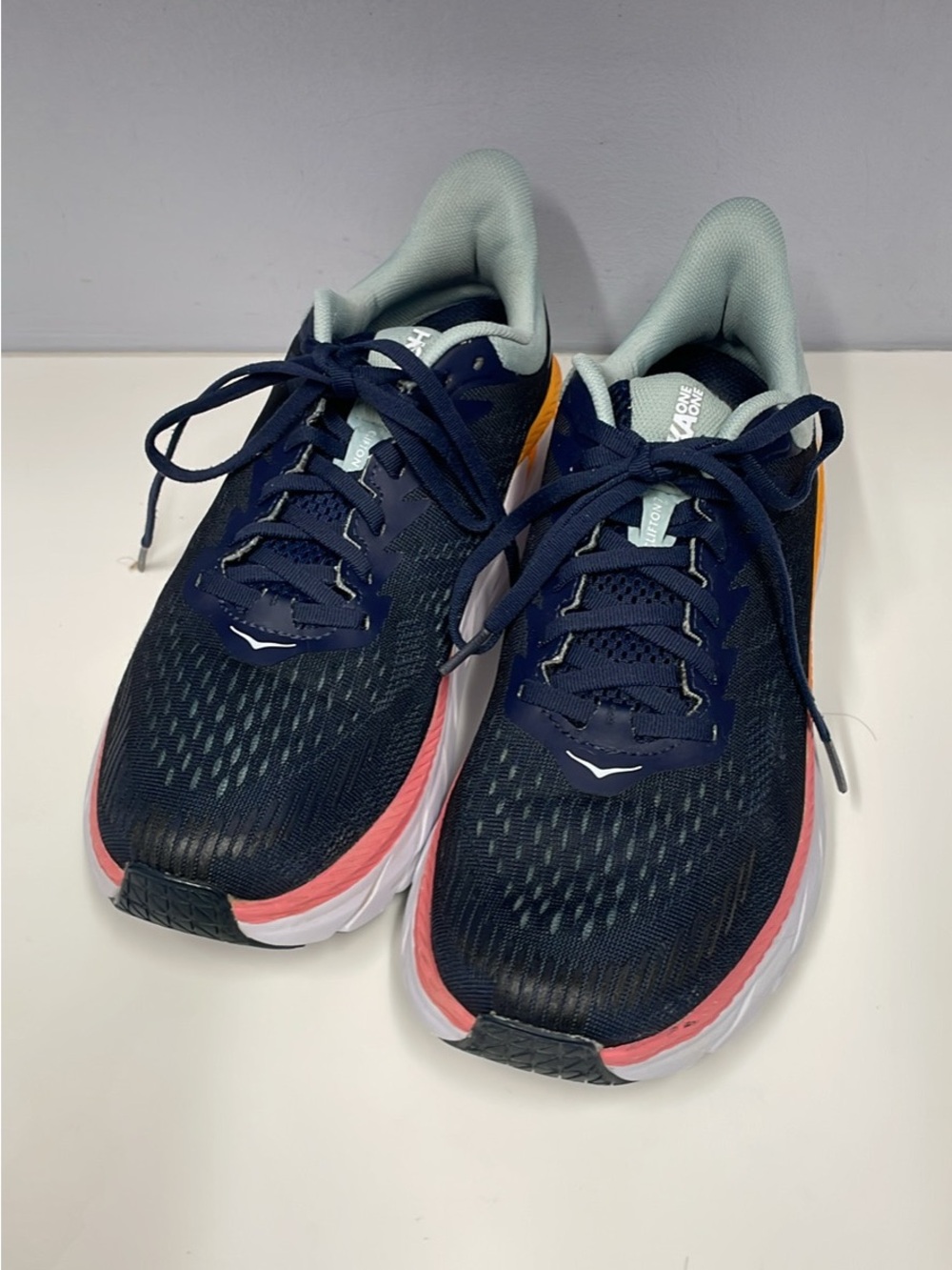 HOKA ONE ONE Woman’s. Navy Running Shoes with Coral and Mint Accents. Size 9